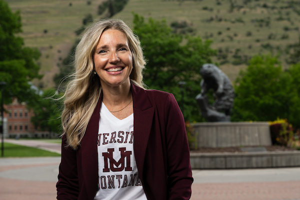 Michelle smiles for a portrait wearing University of Montana apparel along the Oval on the University of Montana campus in Missoula, MT.