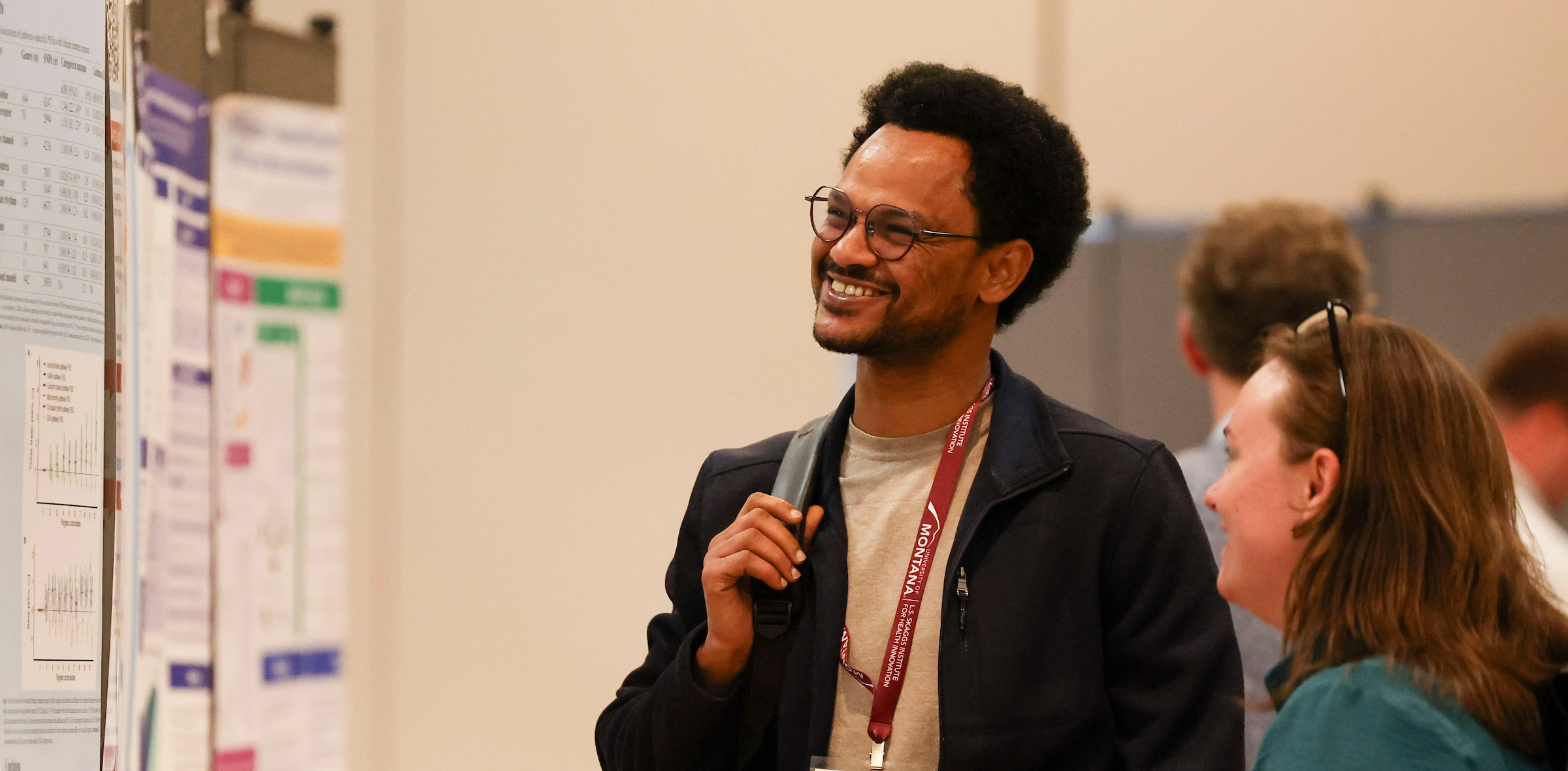 Two students discuss research findings during UM's Conference on Undergraduate Research